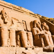 Exquisite ancient temple wall engravings featuring the lucky winged scarab, a highlight of guided tours in Egypt.